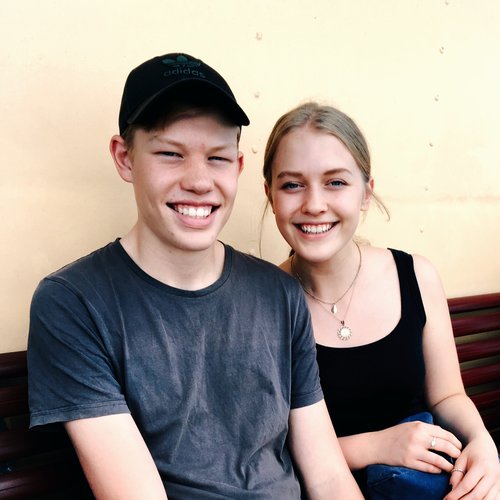 Sister and brother smiling